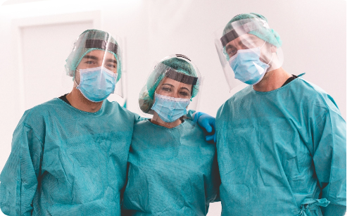 Three Surgeons standing together.