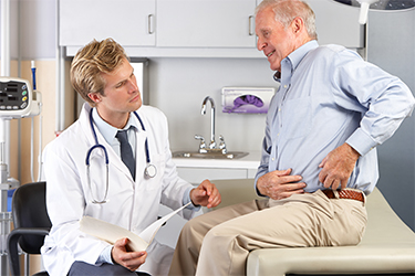 doctor consulting patient with hip pain